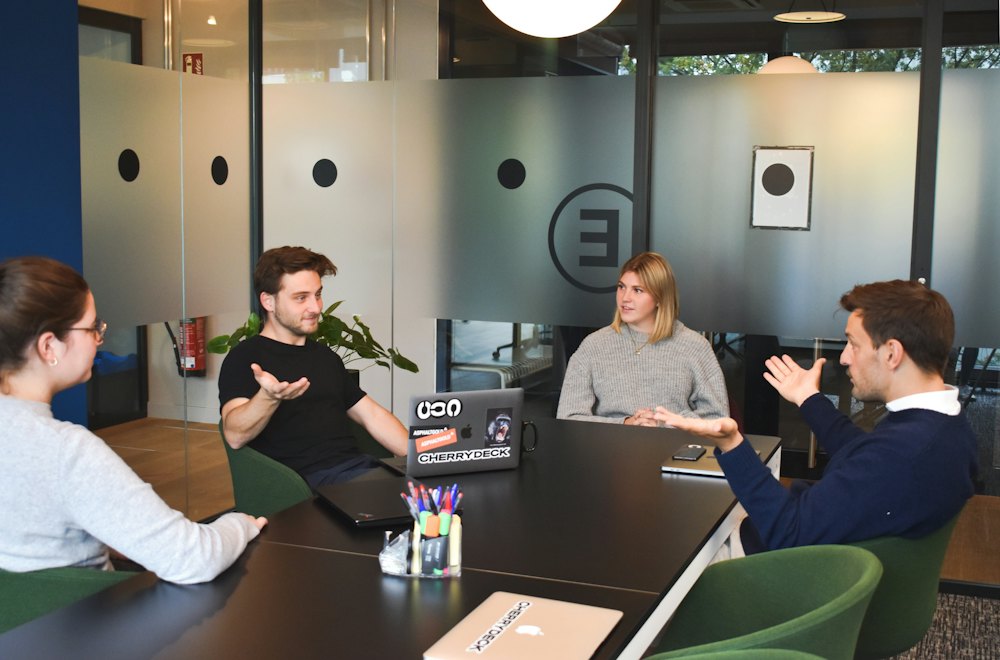 Team meeting around a table in a modern office